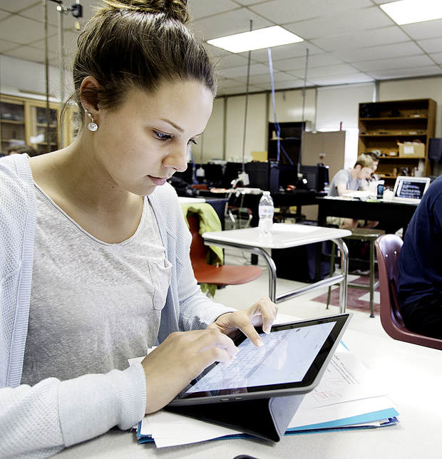 Edward Little High School senior Anna Beaudet works on her iPad during her physics honors class in Auburn.